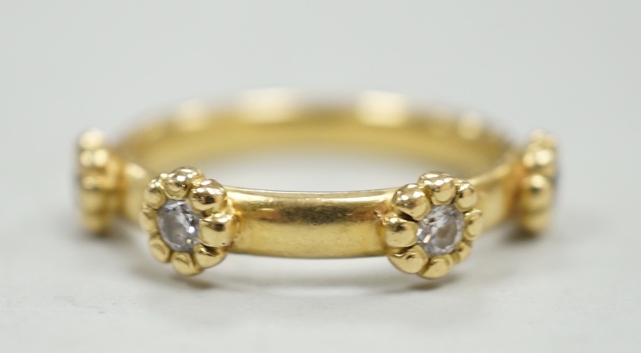 A modern 18ct gold and four stone diamond set ring, size K, gross weight 4 grams.